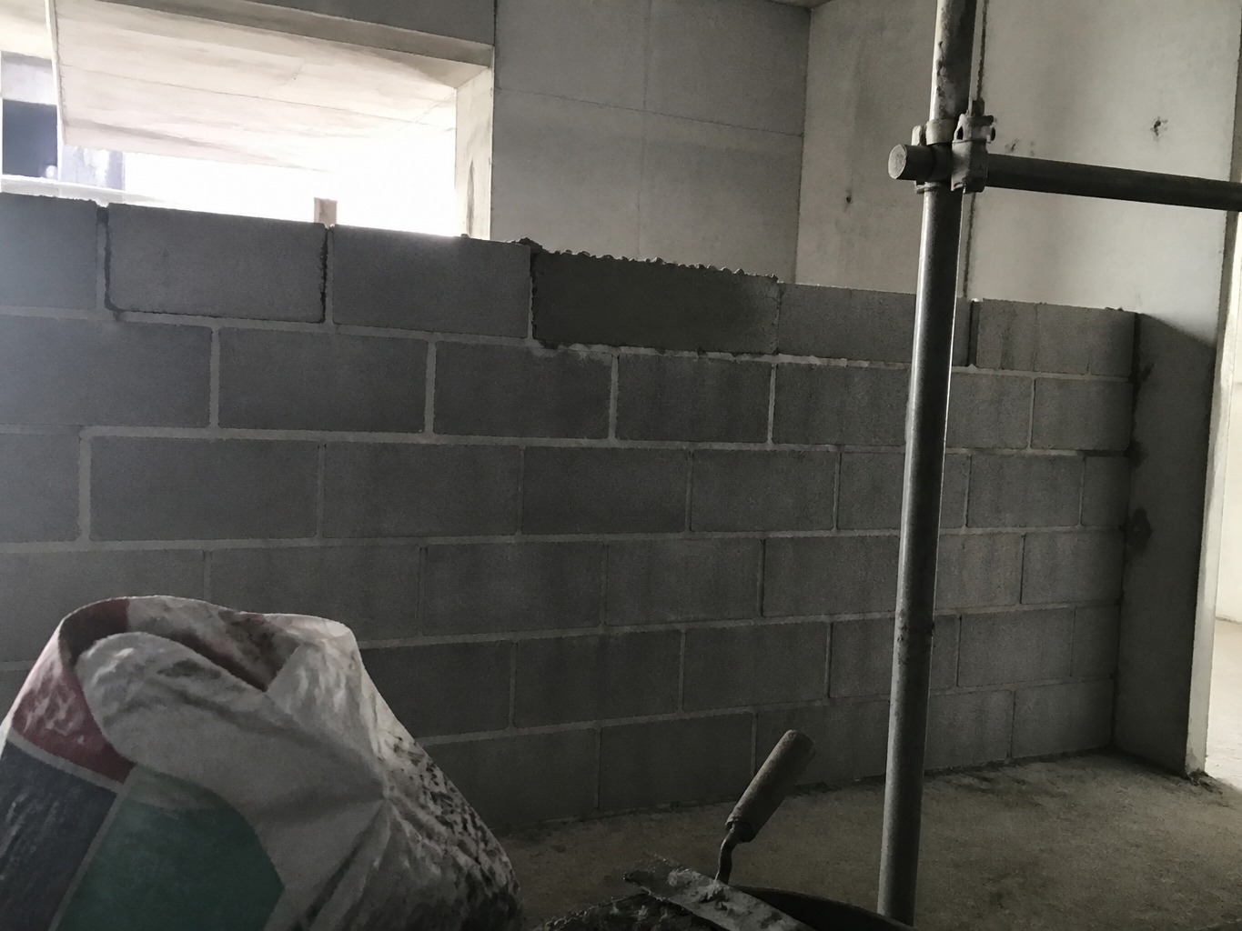 Cinder block wall construction before photographic enhancement