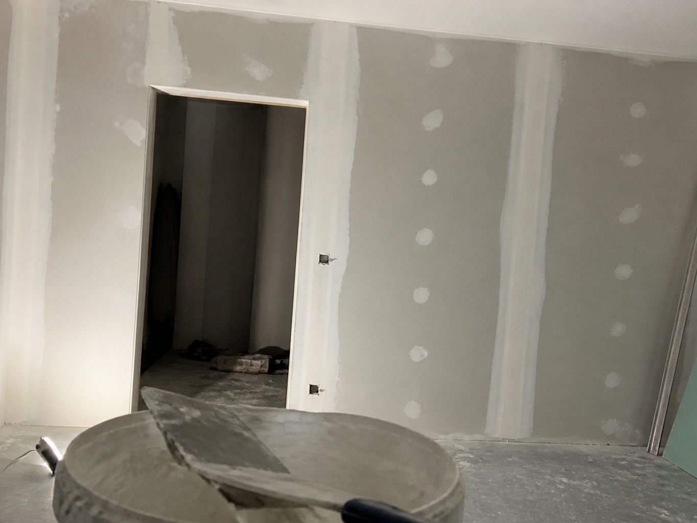 Plasterboard partition installation before photographic enhancement